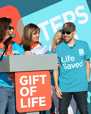 Recipient onstage at Gift of Life event
